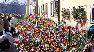 Mourners keeping vigil in front of the palace of Krakow's bishops