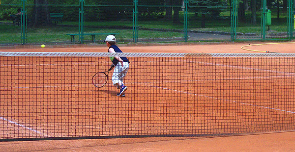 A Krakow boy plays tennis